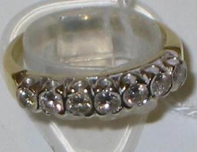 Appraisal: A SEVEN STONE DIAMOND HALF HOOP ETERNITY RING set to