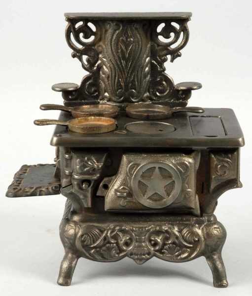 Appraisal: Cast Iron Star Children's Stove Description By either Ideal or