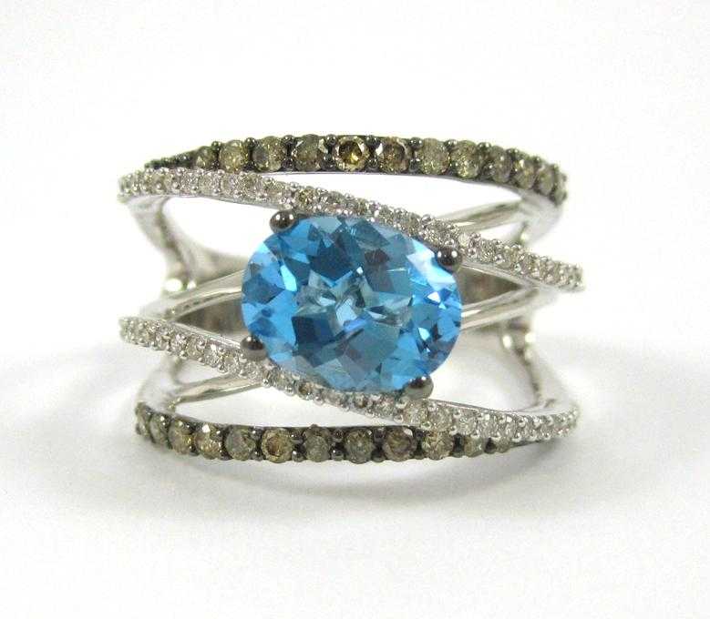 Appraisal: LEVIAN BLUE TOPAZ AND DIAMOND RING The k white gold