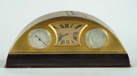 Appraisal: ART DECO DESK CLOCK Semi-circular brass clock case is mounted