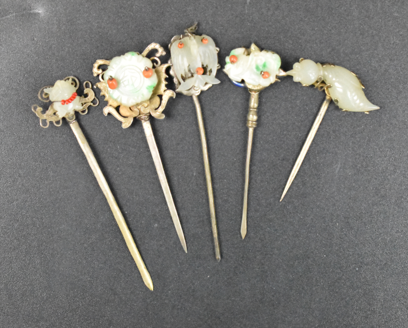 Appraisal: Five Chinese jade jadeite hairpins dating from the Qing dynasty