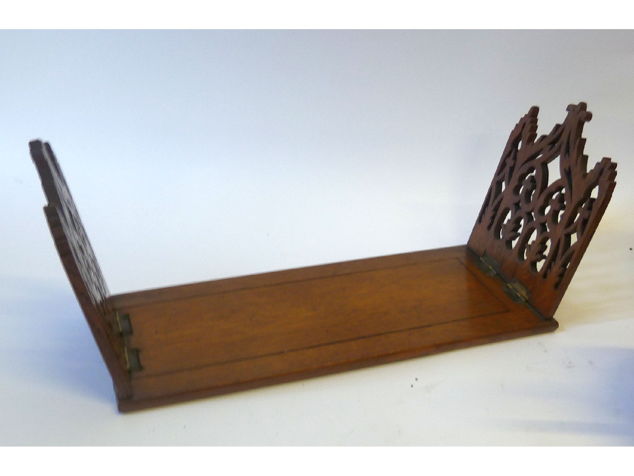 Appraisal: A MAHOGANY GOTHIC REVIVAL BOOKSTAND with hinged pierced ends cm