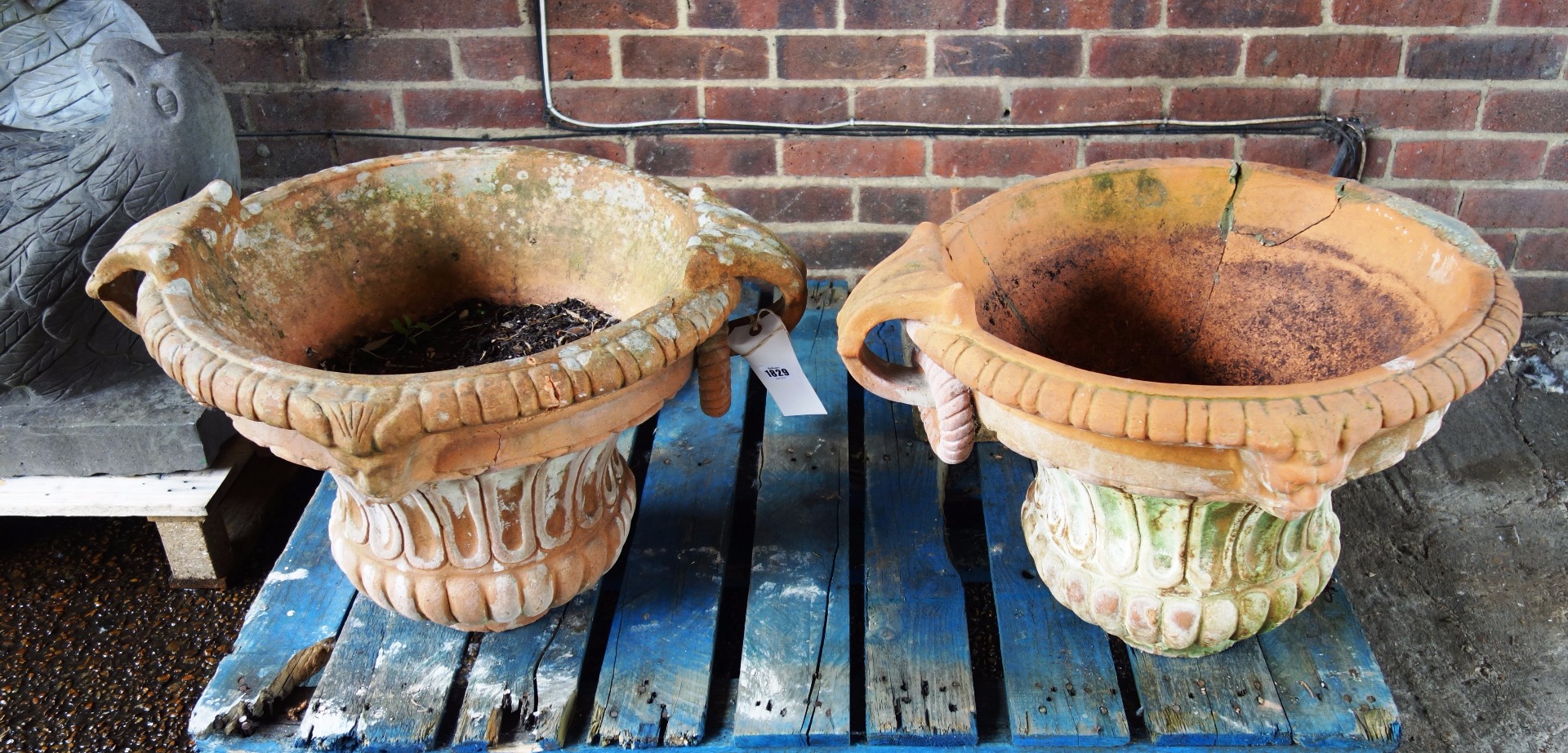 Appraisal: A terracotta jardiniere with semi-fluted body and shaped socle cm