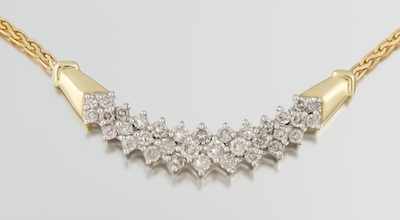 Appraisal: A Ladies' Diamond Cluster Necklace k yellow gold necklace featuring