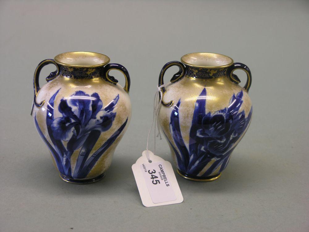 Appraisal: A pair of Royal Doulton bone china vases two handled