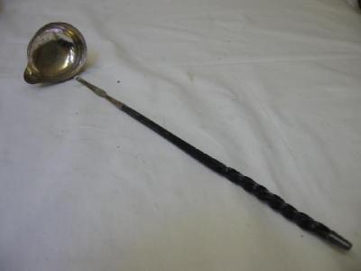 Appraisal: A GEORGE III TODDY LADLE the oval bowl with inset