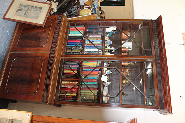 Appraisal: A LATE VICTORIAN MAHOGANY BOOKCASE CABINET with two astal glazed