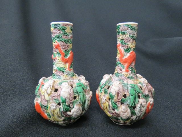 Appraisal: Chinese Pottery Vases raised figures openwork excellent