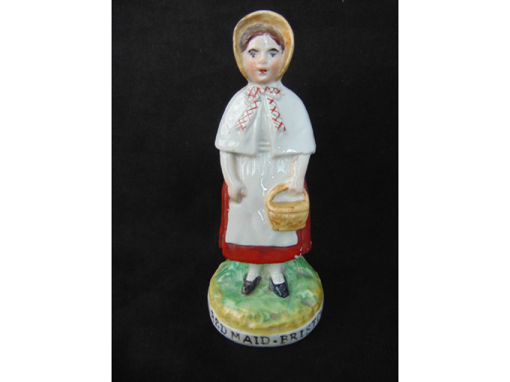 Appraisal: A late th century Staffordshire figure of a Red Maid