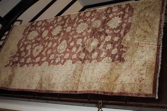 Appraisal: A ZIEGLER STYLE SOFA CARPET with central foliate designs within