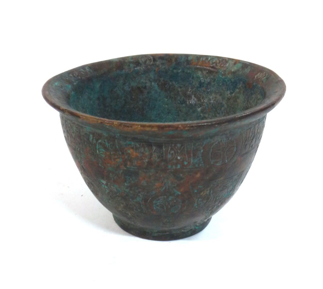 Appraisal: A small Persian bronze mortar Khorassan th th century engraved