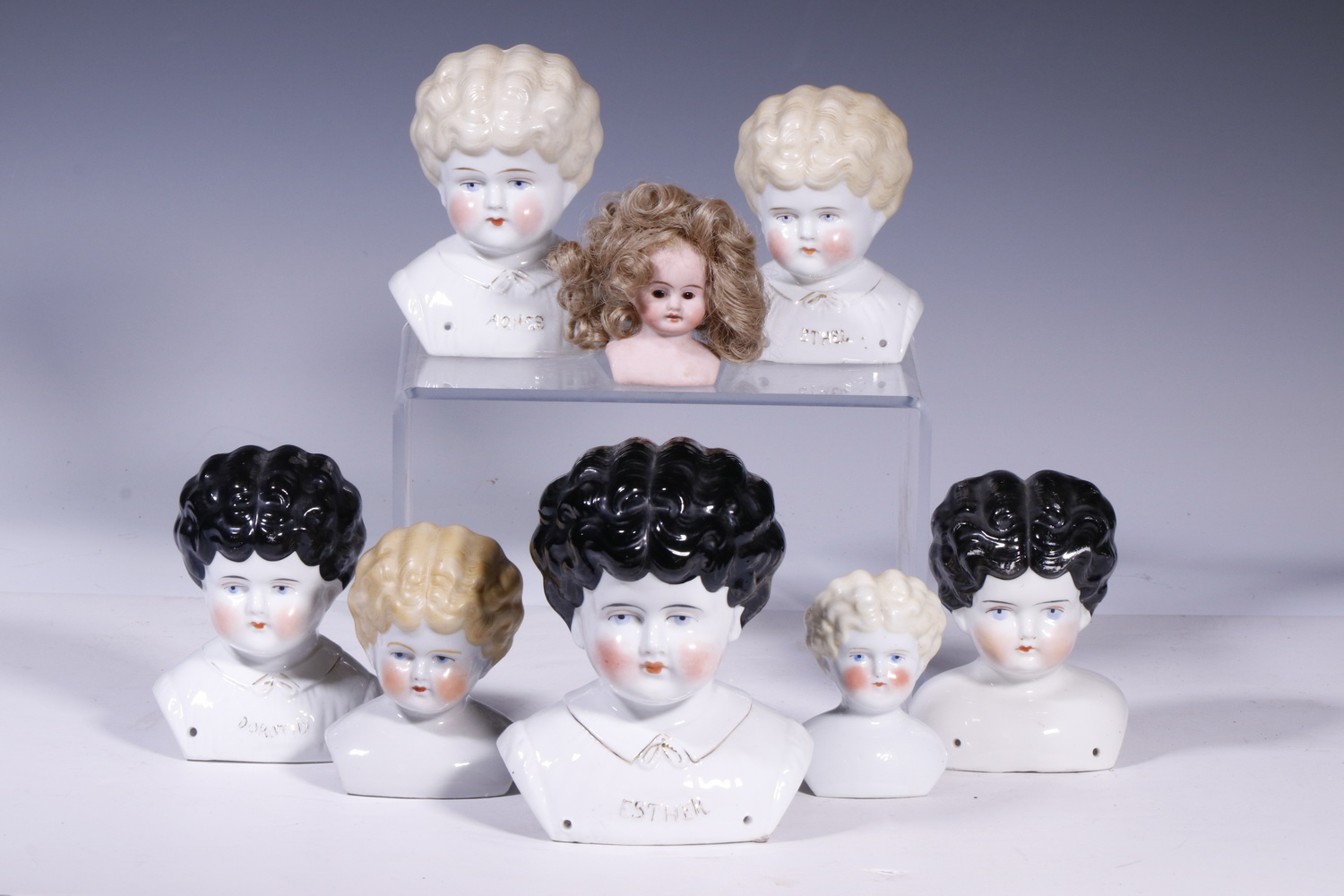 Appraisal: GERMAN CHINA BISQUE DOLL HEADS Lot of Antique Doll Heads