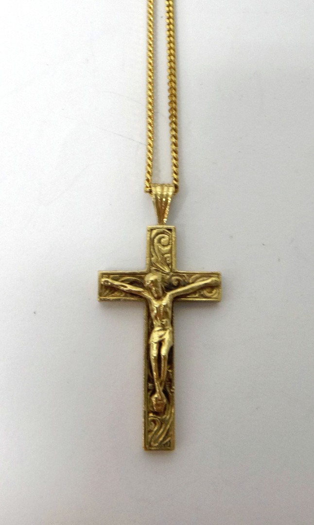 Appraisal: A ct gold pendant crucifix with a ct gold faceted