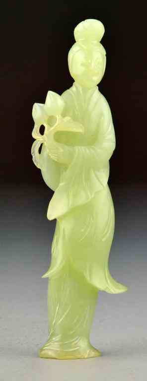 Appraisal: Chinese Qing Carved Celedon Jade Figural CarvingCarved to depict a