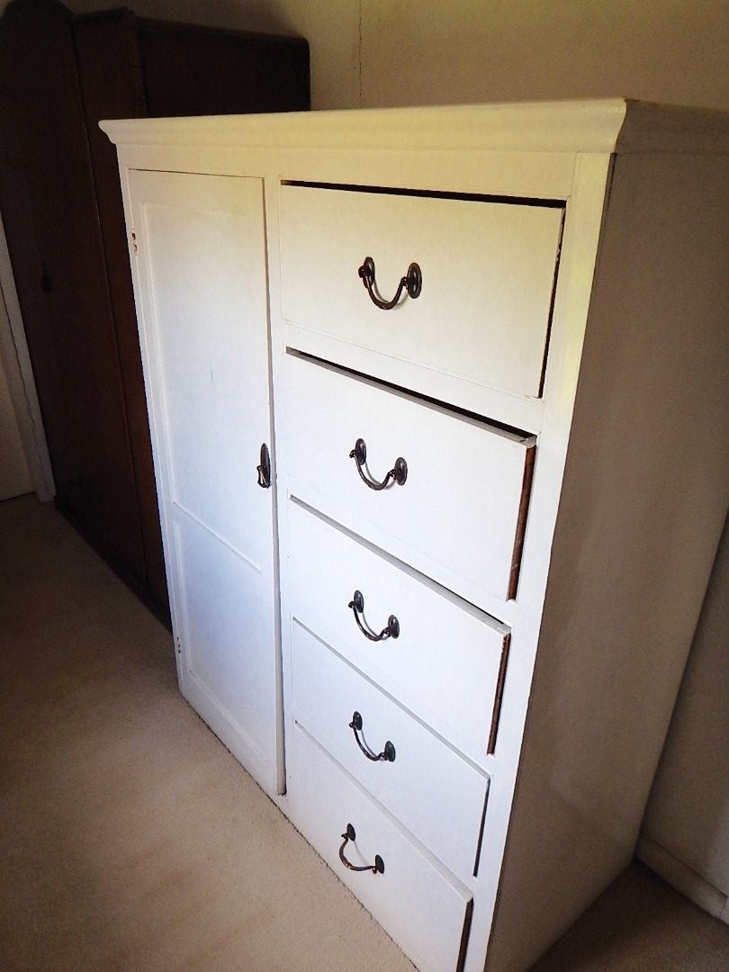 Appraisal: A low white painted wardrobe chest of pine and plywood