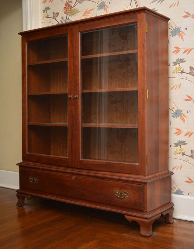 Appraisal: CHERRY BOOK CASE glass front doors wood shelves over single