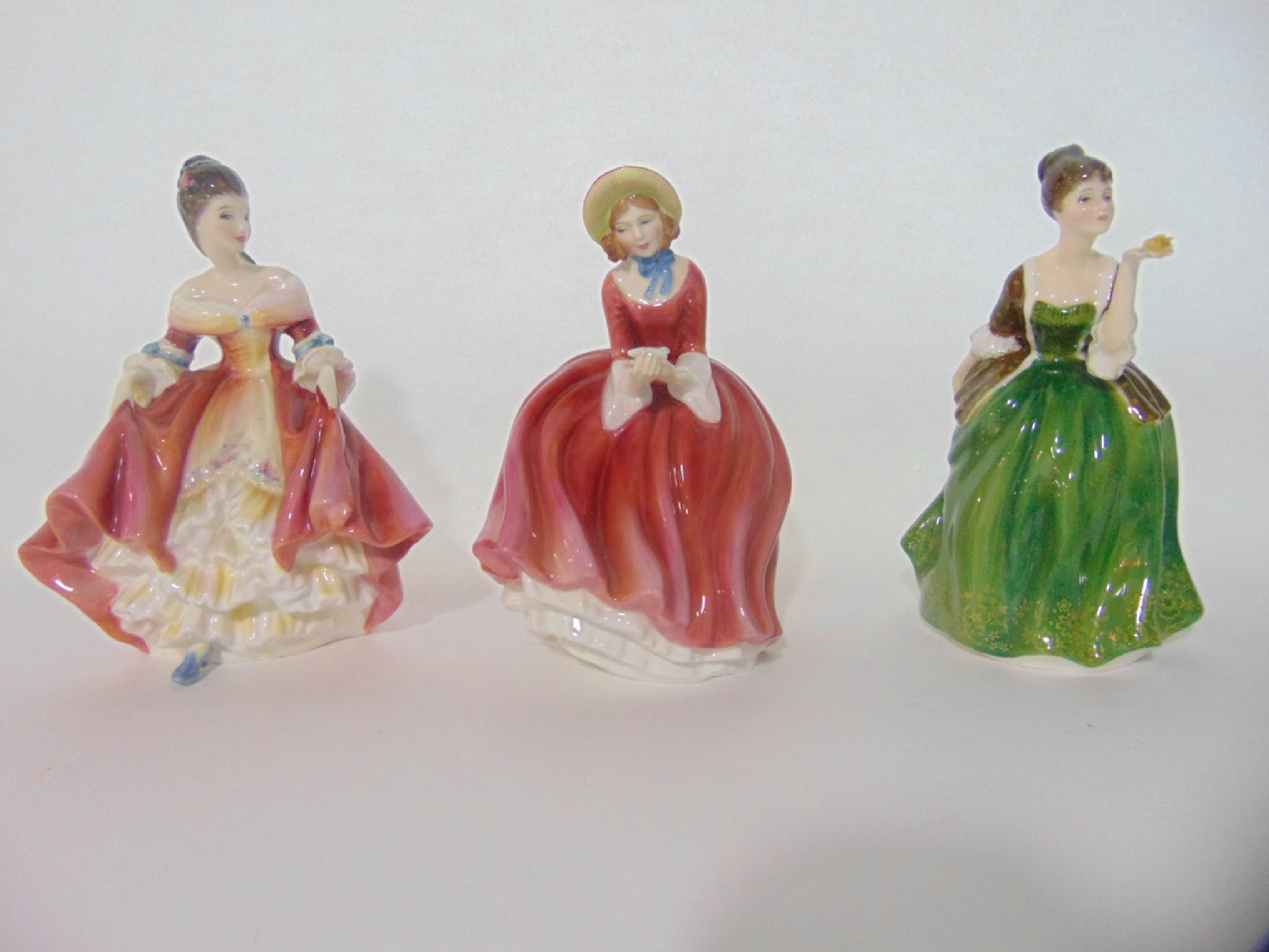 Appraisal: Three Royal Doulton figures comprising Fleur HN Southern Belle HN