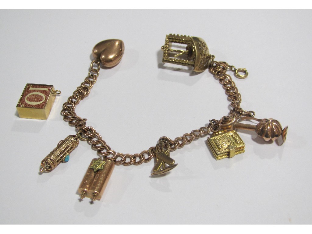 Appraisal: Nine carat gold charm bracelet with eight various gold charms