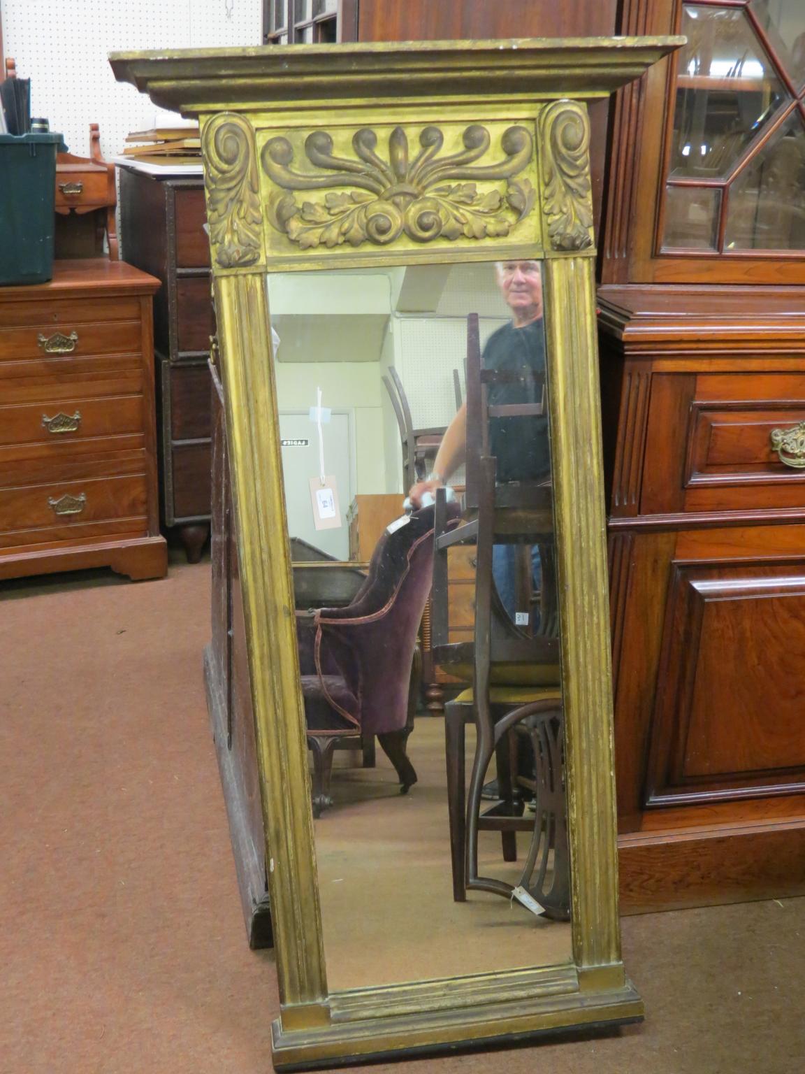 Appraisal: A Regency-period gilt pier glass with anthemion frieze mirror plate