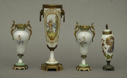 Appraisal: Four Continental Gilt-Metal Mounted Porcelain Mantel Vases Tallest vase in