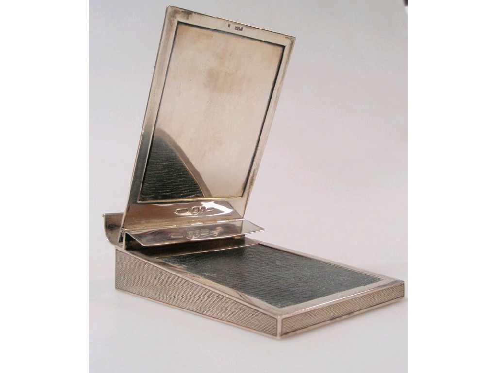 Appraisal: An Asprey silver note pad and pencil holder London