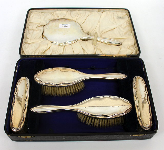 Appraisal: AN OLD SILVER BACKED DRESSING TABLE SET with hand mirror