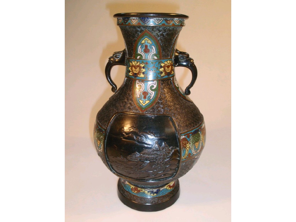 Appraisal: A Chinese bronze two-handled vase with reserves of landscape decoration