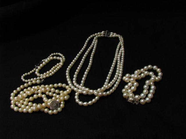 Appraisal: Four Pearl necklaces including three strand with sterling silver clasp