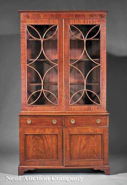 Appraisal: A Regency Carved Mahogany Bookcase and Cabinet th c cove