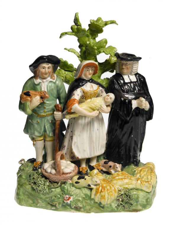 Appraisal: A STAFFORDSHIRE PEARLWARE GROUP OF THE TITHE PIG the farmer