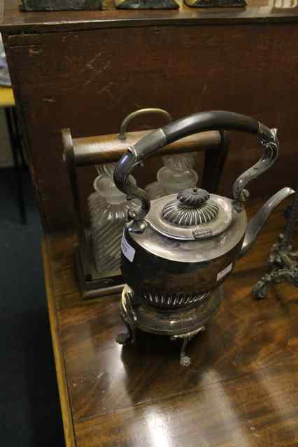 Appraisal: A SMALL OAK FRAMED TWO DECANTER TANTALUS with fluted decanters