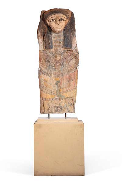 Appraisal: An Egyptian sarcophagus cover Late to Ptolemaic An Egyptian polychrome