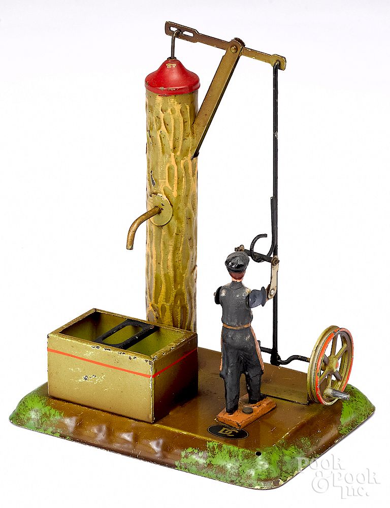 Appraisal: Doll painted tin man at pump steam toy accessory Doll