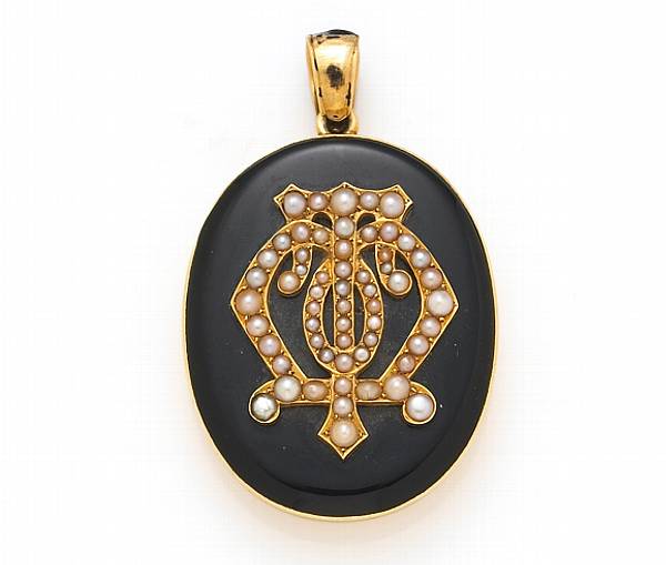 Appraisal: A Victorian black enamel and fourteen karat gold locket with