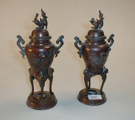 Appraisal: A pair of Japanese bronze koro with covers high