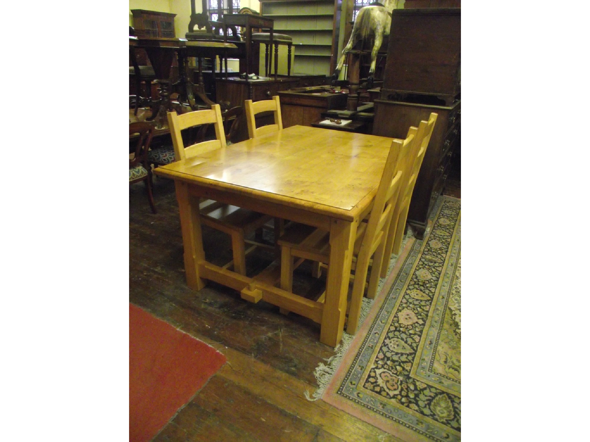 Appraisal: A substantial oak farmhouse dining table with heavy plank top