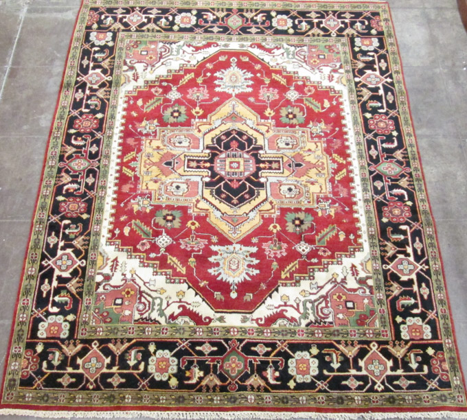 Appraisal: HAND KNOTTED ORIENTAL CARPET Persian Serapi design central a large