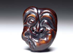 Appraisal: ANTIQUE WOOD MASK NETSUKE Large and antique wood mask netsuke