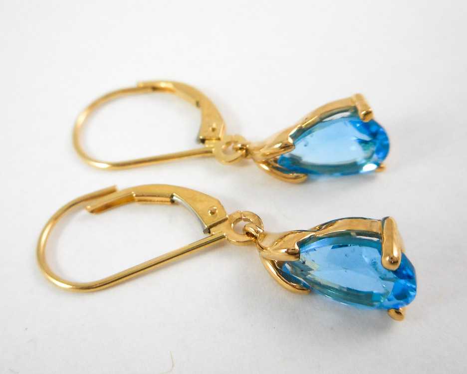 Appraisal: PAIR OF BLUE TOPAZ DANGLE EARRINGS each k yellow gold