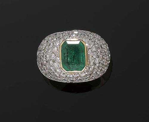 Appraisal: EMERALD AND DIAMOND BAND RING Yellow gold Domed front set