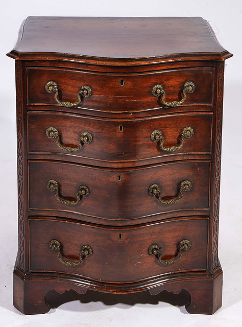 Appraisal: A SMALL CHIPPENDALE STYLE MAHOGANY SERPENTINE FRONTED CHEST of four