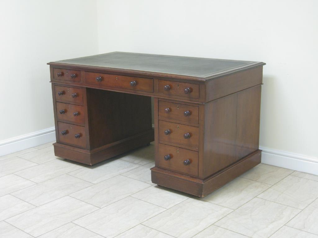 Appraisal: A mahogany double pedestal Desk leather inset top fitted nine