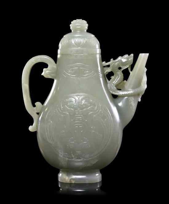 Appraisal: A Carved Jade Lidded Ewer of pale celadon colored stone