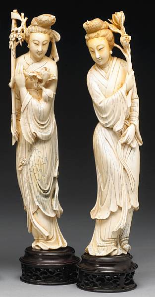 Appraisal: A pair of tinted ivory beauties First half of th