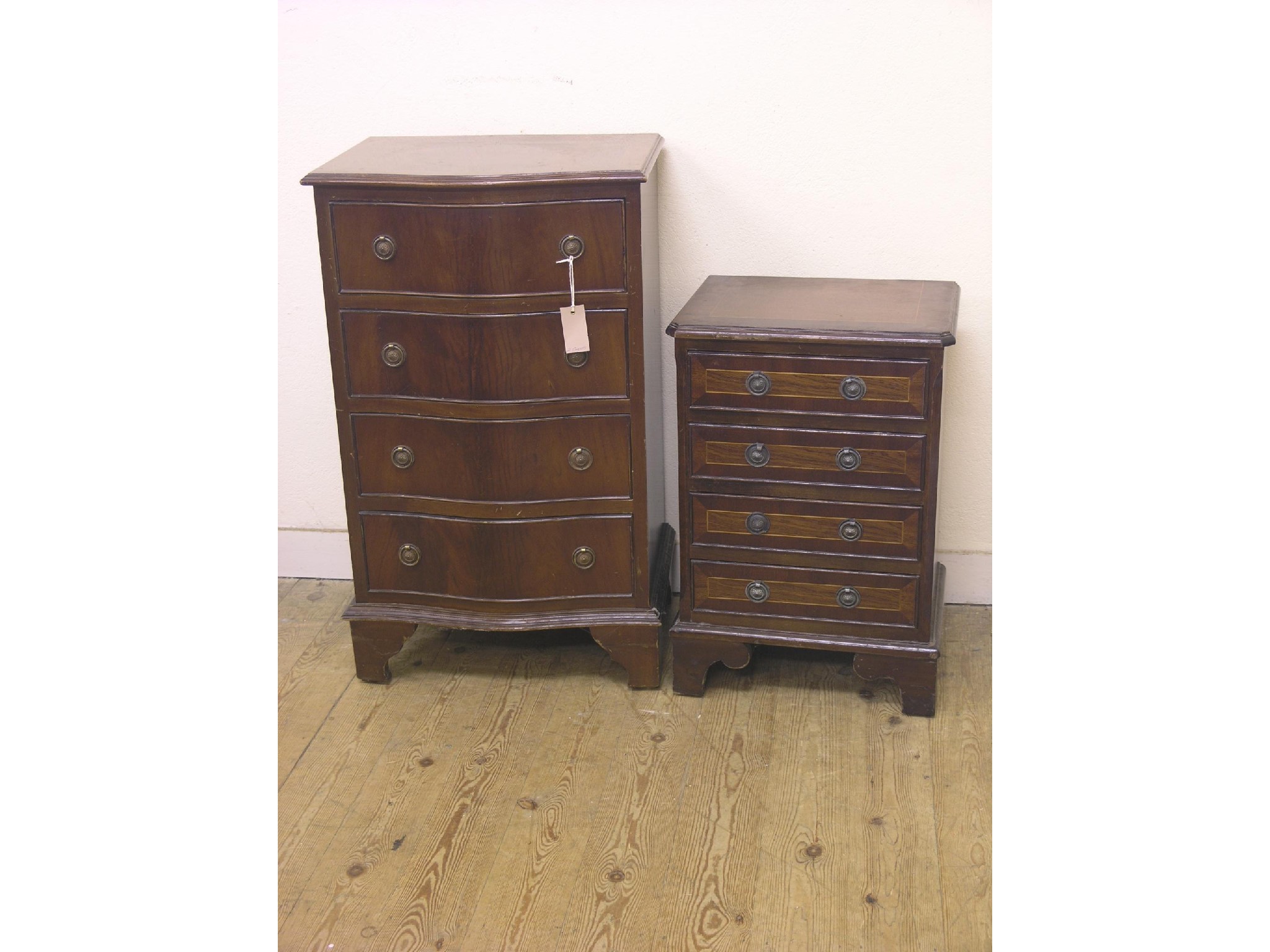 Appraisal: Two small reproduction mahogany chests each with four drawers