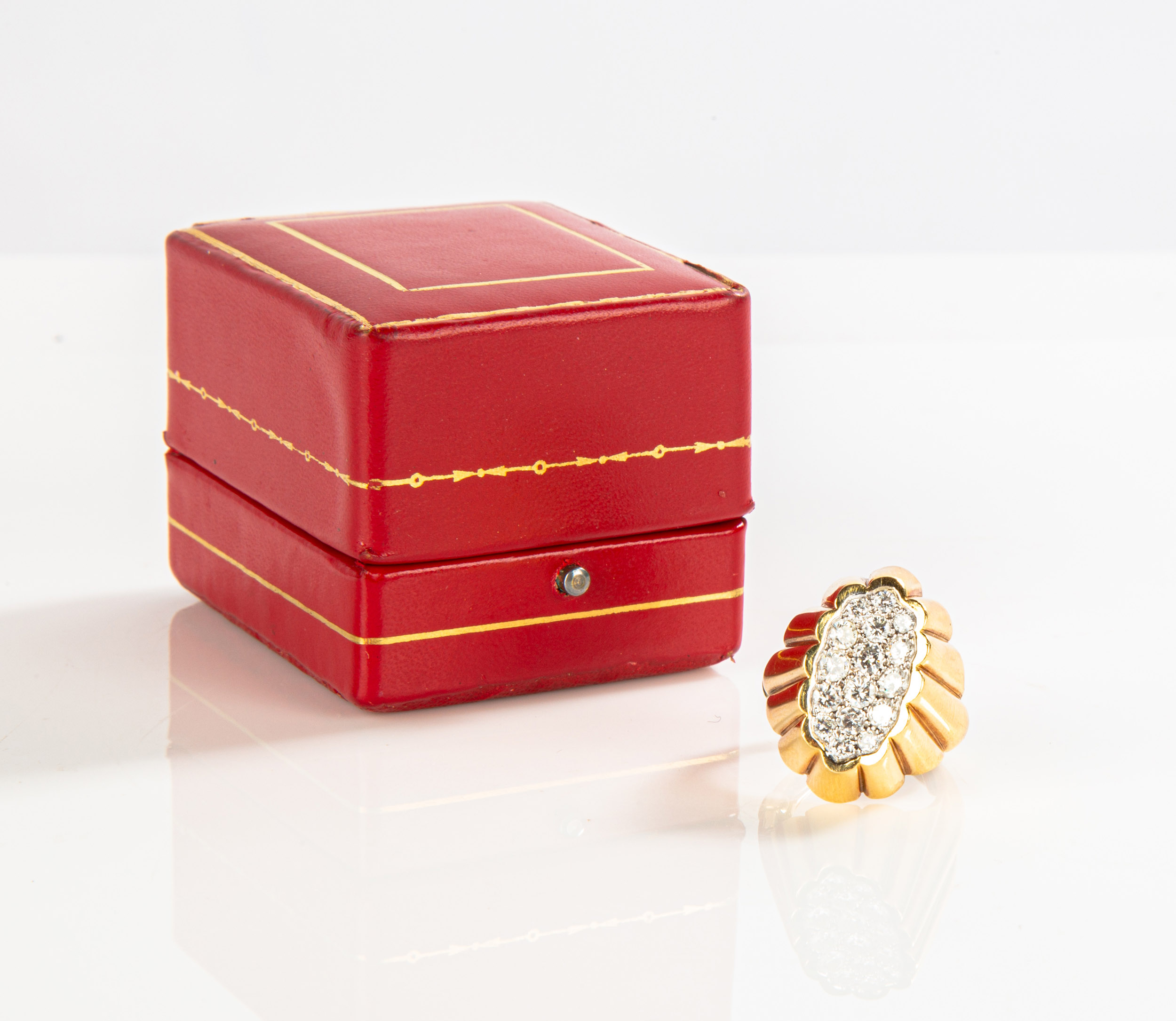 Appraisal: K GOLD AND DIAMOND CARTIER RING Signed Cartier and impressed