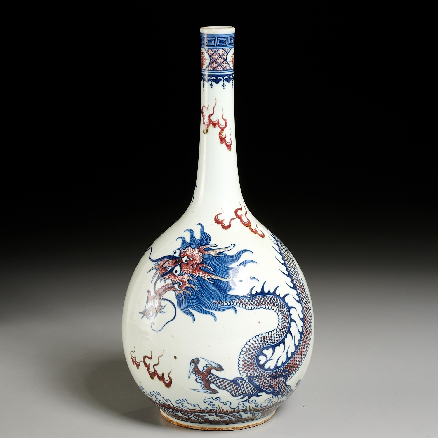 Appraisal: CHINESE BLUE AND RED DRAGON BOTTLE VASE Qing Dynasty th