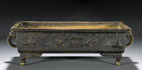 Appraisal: A patinated bronze usubata Meiji Period Of rectangular shape resting