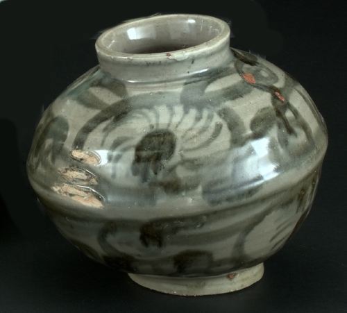 Appraisal: Annamese Flow-Charcoal and Gray-Glazed Spherical Pottery Storage Jar in stylized