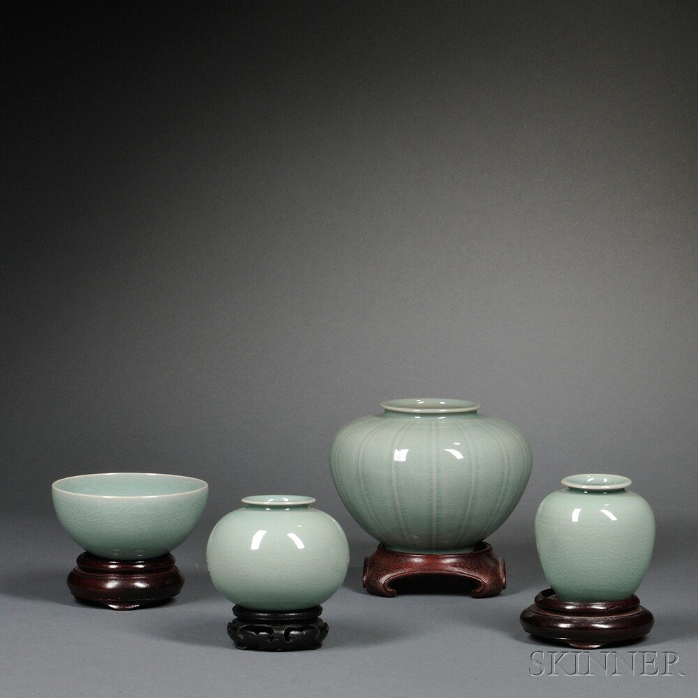 Appraisal: Four Contemporary Celadon Items on Wood Stands Korea a bowl